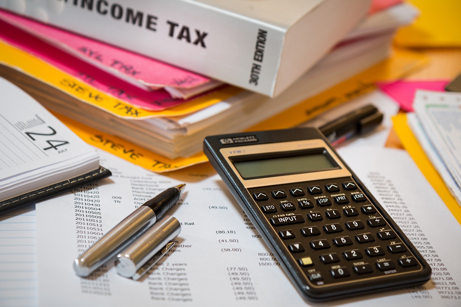 Tax files, a pen and a calculator
